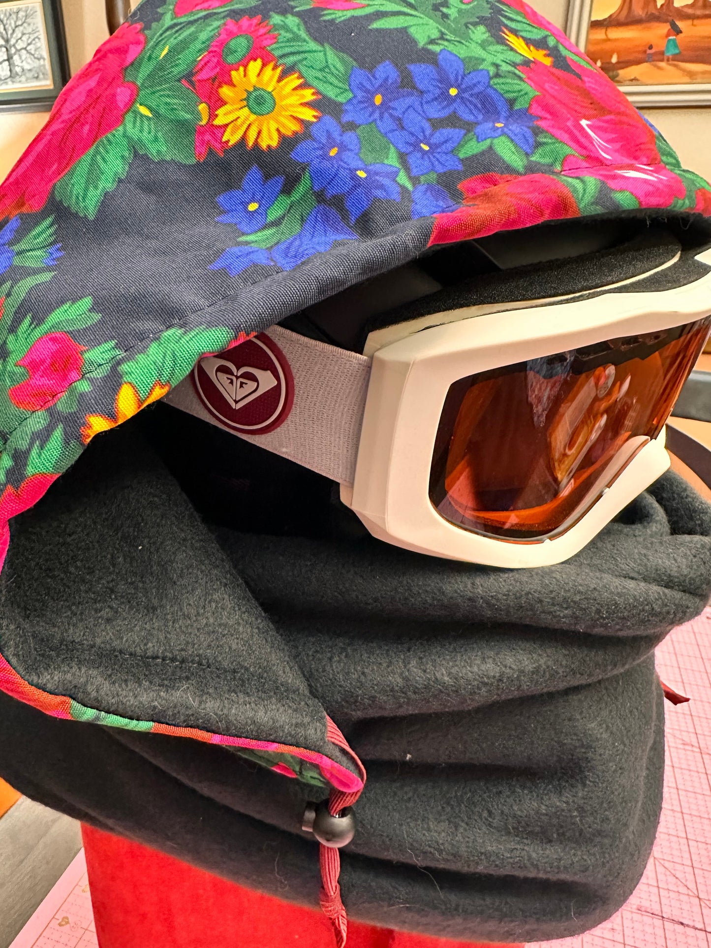 Colorful floral pattern on black balaclava with a hood and neck gaiter